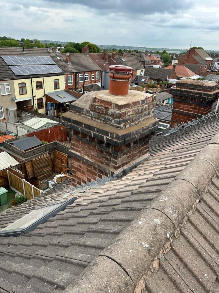 This is a photo taken from a roof which is being repaired by Downham Market Roofing Repairs, it shows a street of houses, and their roofs